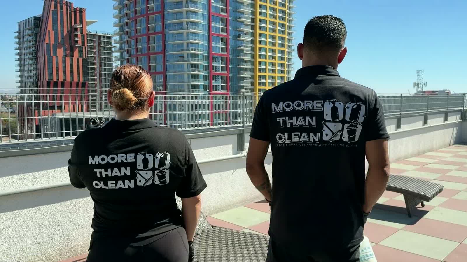 Moore Than Clean crew members arriving at a downtown property